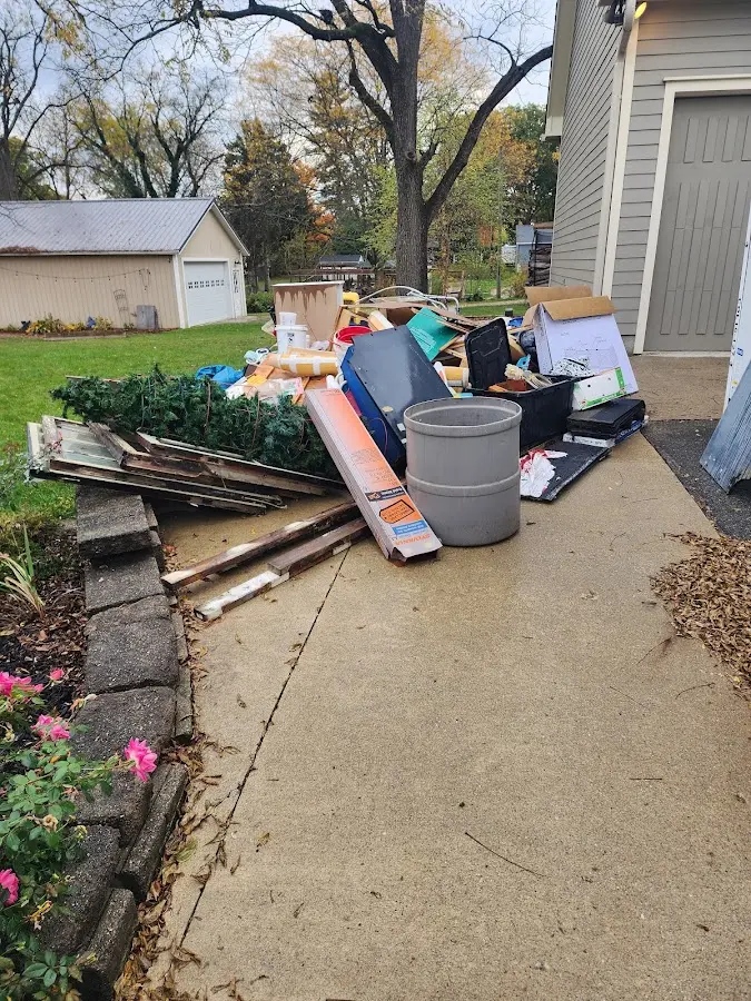 Dumpster being loaded with debris for Commercial Dumpster Rental in Klamath Falls